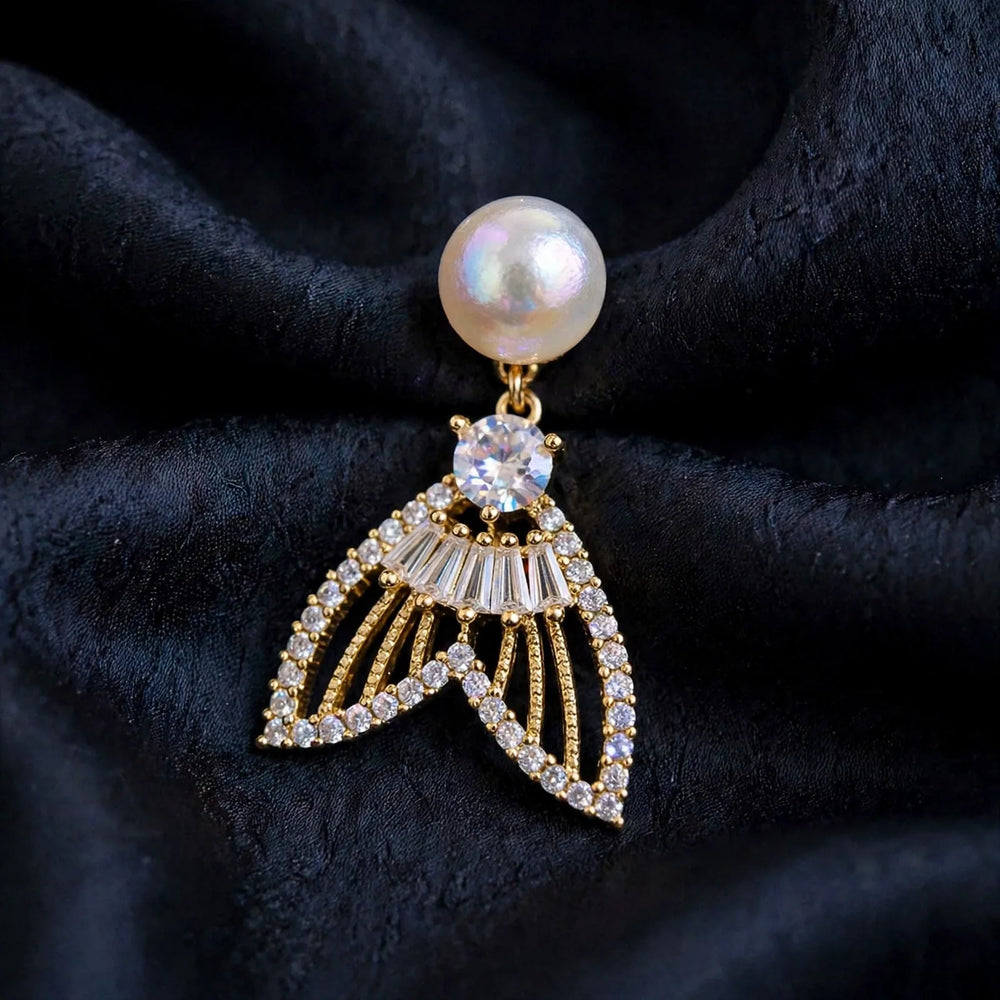 Pearl, crystal, and a golden fan